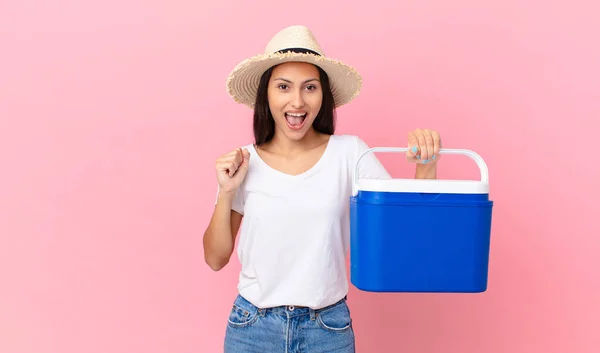 Pretty Hispanic Woman Feeling Shocked Laughing Celebrating Success Holding Portable — Stock Photo, Image