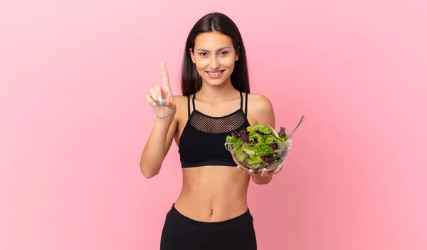 Hispanic Fitness Woman Smiling Looking Friendly Showing Number One Holding — ストック写真