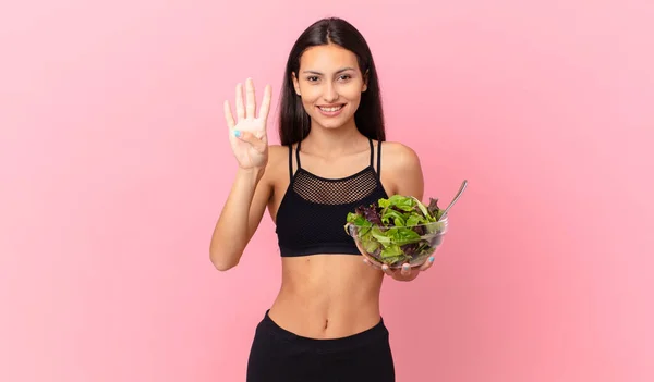 Hispanic Fitness Woman Smiling Looking Friendly Showing Number Four Holding — ストック写真