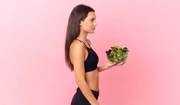 Hispanic Fitness Woman Profile View Thinking Imagining Daydreaming Holding Salad — Fotografia de Stock