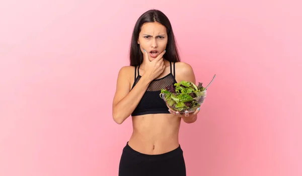 Hispanic Fitness Woman Mouth Eyes Wide Open Hand Chin Holding — Stock fotografie