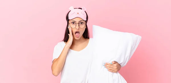 Hispanic Woman Wearing Pajamas Feeling Shocked Scared Holding Pillow — Stok fotoğraf