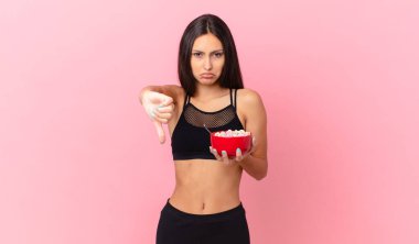 pretty hispanic woman with a diet breakfast bowl
