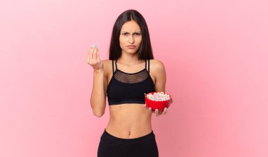 pretty hispanic woman with a diet breakfast bowl