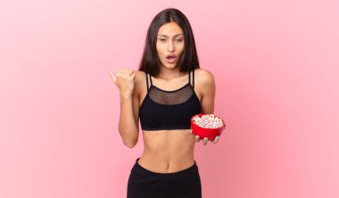 pretty hispanic woman with a diet breakfast bowl