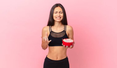 pretty hispanic woman with a diet breakfast bowl