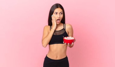 pretty hispanic woman with a diet breakfast bowl
