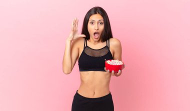 pretty hispanic woman with a diet breakfast bowl