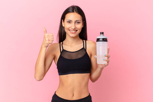 pretty fitness woman with a water bottle