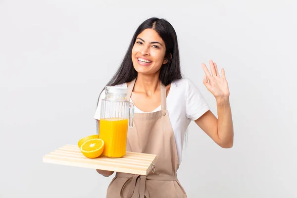 Pretty Hispanic Chef Woman Smiling Happily Waving Hand Welcoming Greeting — Stock Photo, Image