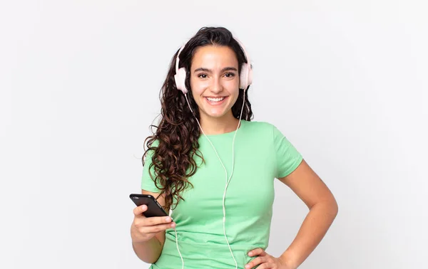 Pretty Hispanic Woman Smiling Happily Hand Hip Confident Headphones Smartphone — Stock Photo, Image