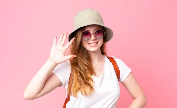 Red Head Pretty Woman Tourist Smiling Looking Friendly Showing Number — Stock Photo, Image