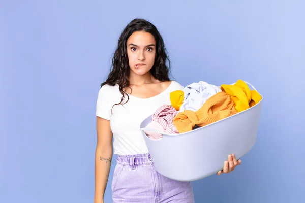 Hispanic Pretty Woman Looking Puzzled Confused Holding Washing Clothes Basket — Stock Photo, Image