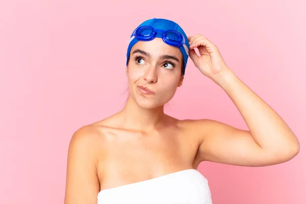 Hispanic Pretty Swimmer Woman Feeling Puzzled Confused Scratching Head Goggles — Stockfoto