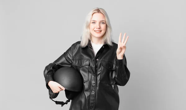 Blond Pretty Woman Smiling Looking Friendly Showing Number Three Motorbike — Foto Stock