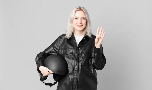 Blond Pretty Woman Smiling Looking Friendly Showing Number Four Motorbike — Foto Stock