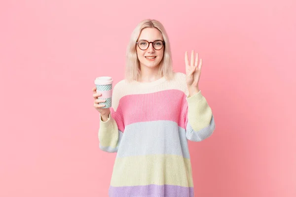 Blond Pretty Woman Smiling Looking Friendly Showing Number Four Coffee — Foto Stock