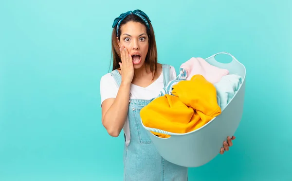 Young Hispanic Woman Feeling Shocked Scared Washing Clothes — Stok Foto