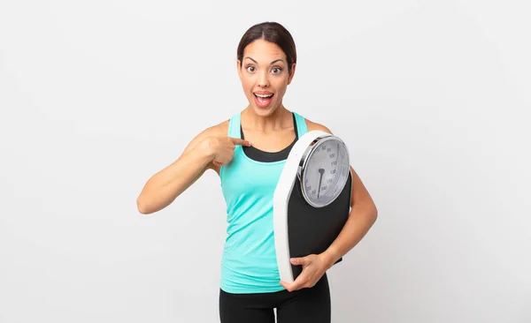Young Hispanic Woman Feeling Happy Pointing Self Excited Holding Scale — Stock Photo, Image