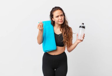 young pretty woman making capice or money gesture, telling you to pay. fitness concept