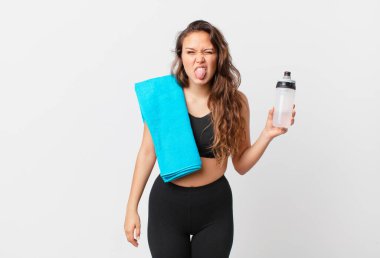 young pretty woman feeling disgusted and irritated and tongue out. fitness concept