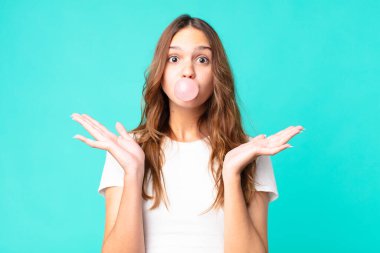 young pretty student with a gum bubble