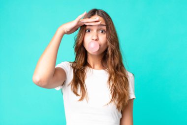 young pretty student with a gum bubble