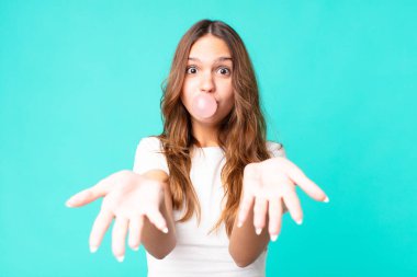 young pretty student with a gum bubble