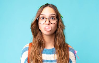 young pretty student with a gum bubble