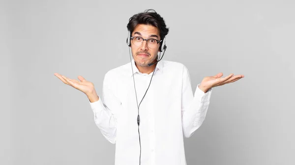 Young Hispanic Man Feeling Puzzled Confused Doubting Telemarketer Concept — Stock Photo, Image