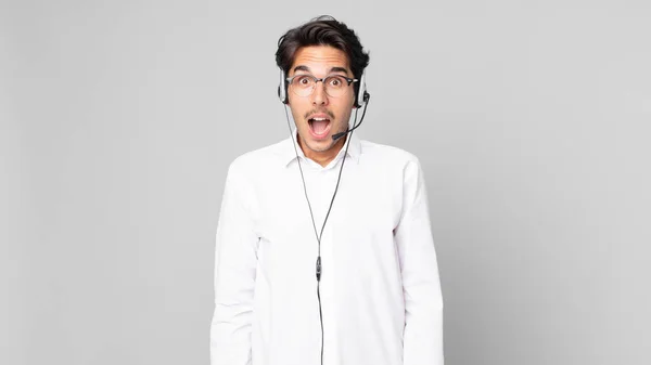 Young Hispanic Man Looking Very Shocked Surprised Telemarketer Concept — Stock Photo, Image
