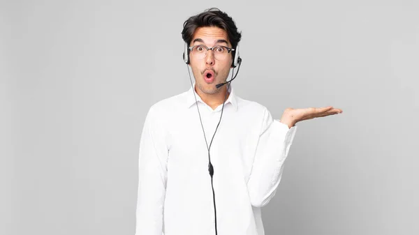 Young Hispanic Man Looking Surprised Shocked Jaw Dropped Holding Object — Stock Photo, Image
