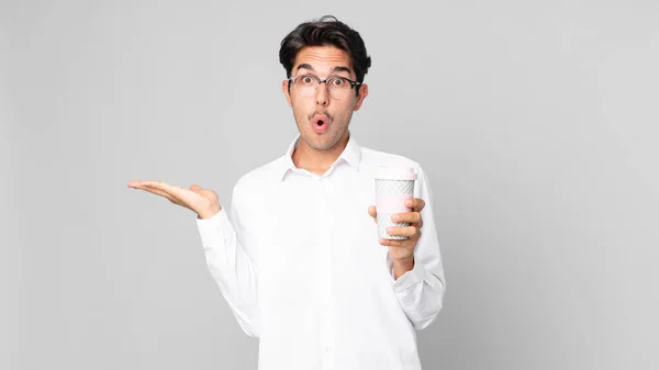 Young Hispanic Man Looking Surprised Shocked Jaw Dropped Holding Object — Stock Photo, Image