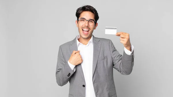 Young Hispanic Man Feeling Happy Pointing Self Excited Holding Credit — Stock Photo, Image