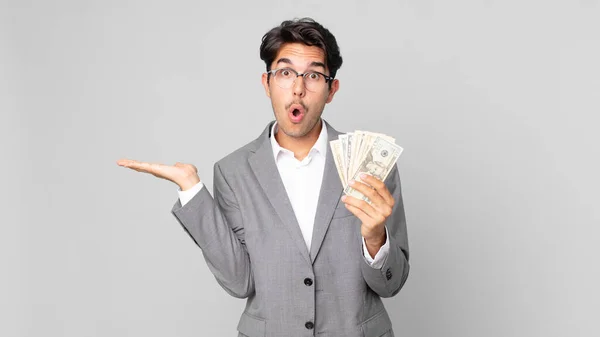 Young Hispanic Man Looking Surprised Shocked Jaw Dropped Holding Object — Stock Photo, Image