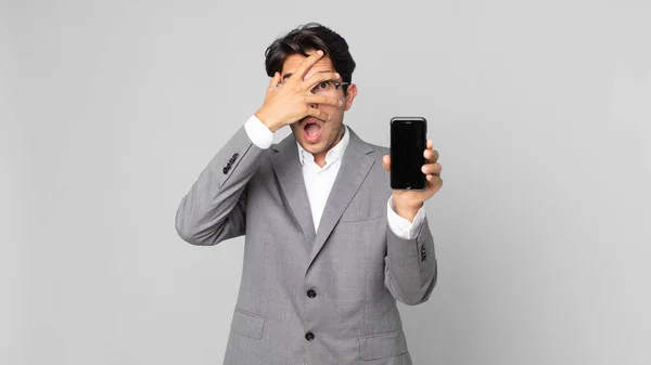 Young Hispanic Man Looking Shocked Scared Terrified Covering Face Hand — Stock Photo, Image