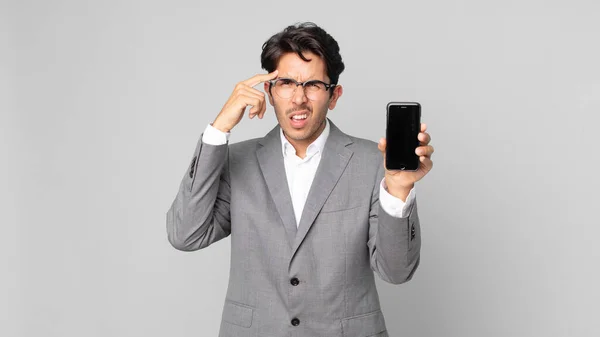 Young Hispanic Man Feeling Confused Puzzled Showing You Insane Holding — Stock Photo, Image