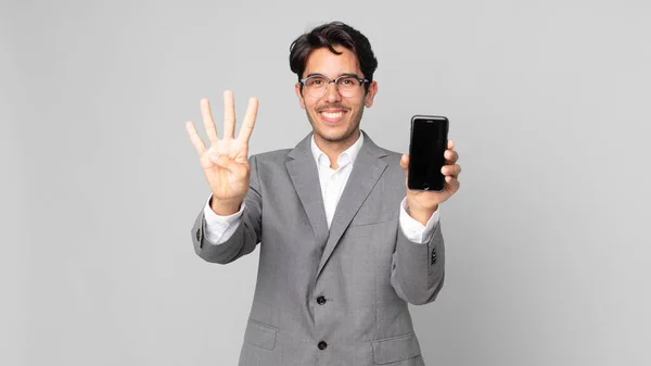 Young Hispanic Man Smiling Looking Friendly Showing Number Four Holding — Stock Photo, Image