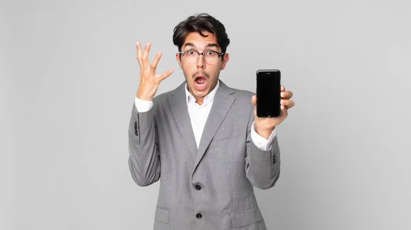 Young Hispanic Man Screaming Hands Air Holding Smartphone — Stock Photo, Image