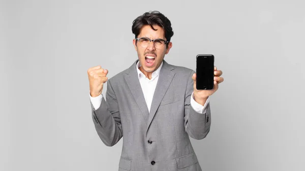 Young Hispanic Man Shouting Aggressively Angry Expression Holding Smartphone — Stock Photo, Image