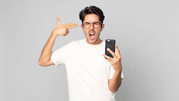 Joven Hombre Hispano Buscando Infeliz Estresado Gesto Suicida Haciendo Signo —  Fotos de Stock