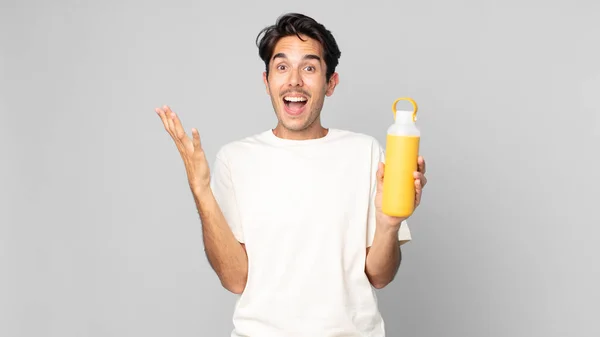 Young Hispanic Man Feeling Happy Astonished Something Unbelievable Coffee Thermos — Stock Photo, Image