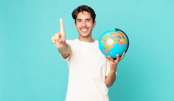 Joven Hombre Hispano Sonriendo Orgullosamente Con Confianza Haciendo Número Uno —  Fotos de Stock