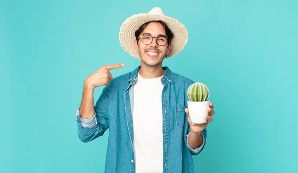Young Hispanic Man Smiling Confidently Pointing Own Broad Smile Holding — Stock Photo, Image