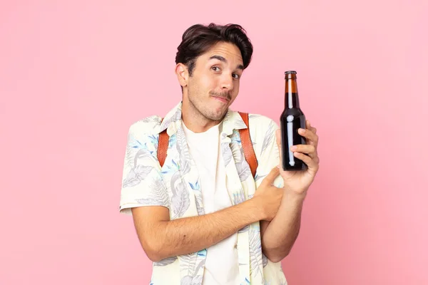 Young Hispanic Man Shrugging Feeling Confused Uncertain Holding Bottle Beer — Stock Photo, Image