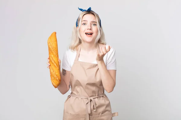 Young Pretty Albino Woman Looking Desperate Frustrated Stressed Bread Baguette — Stock Photo, Image