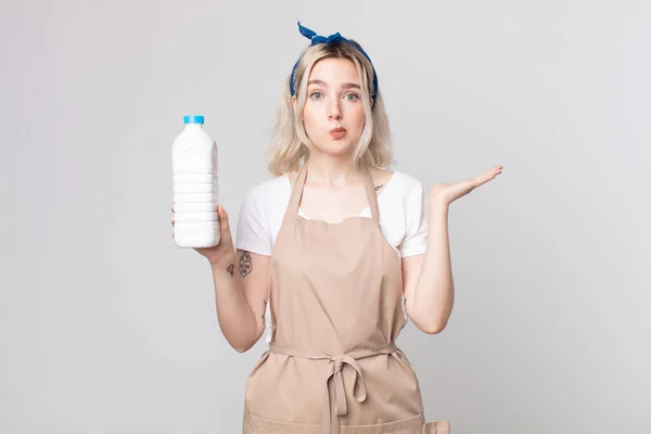 Young Pretty Albino Woman Feeling Puzzled Confused Doubting Bottle Milk — Stock Photo, Image