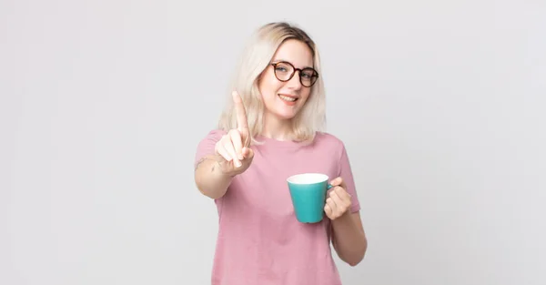 Young Pretty Albino Woman Smiling Proudly Confidently Making Number One — Stock Photo, Image