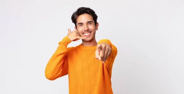 Hispanic Handsome Man Smiling Cheerfully Pointing Camera While Making Call — Stock Photo, Image