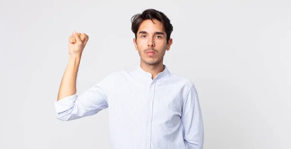 Hispanic Handsome Man Feeling Serious Strong Rebellious Raising Fist Protesting — Stock Photo, Image